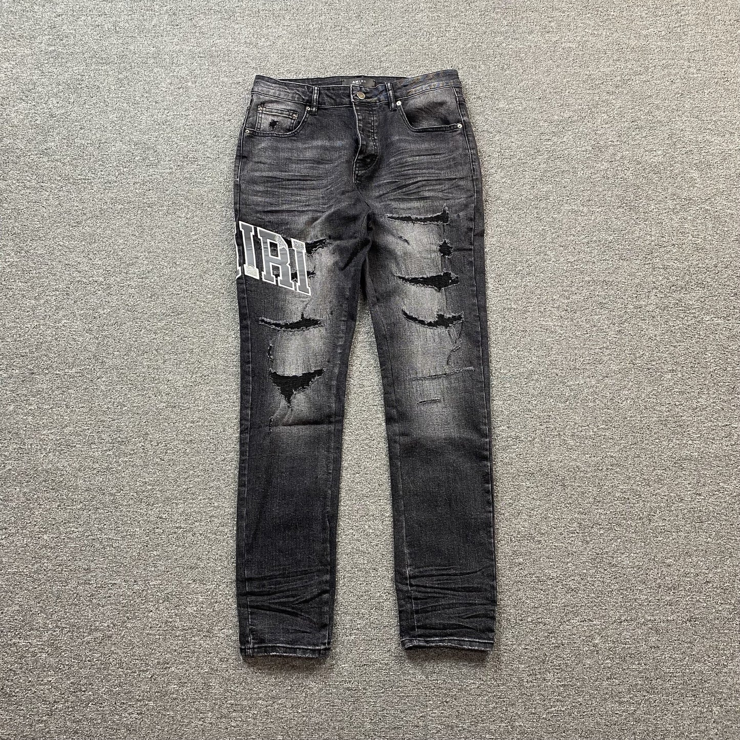 AMIRI VARSITY LOGO REPAIR JEANS - Vanté®