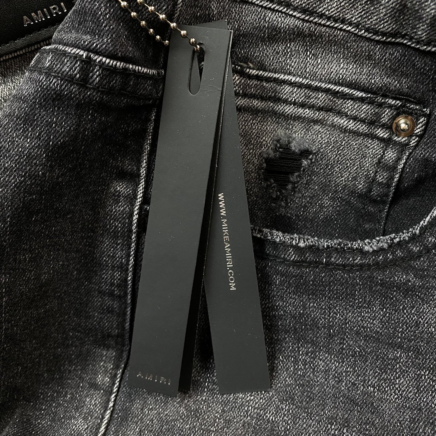 AMIRI VARSITY LOGO REPAIR JEANS - Vanté®