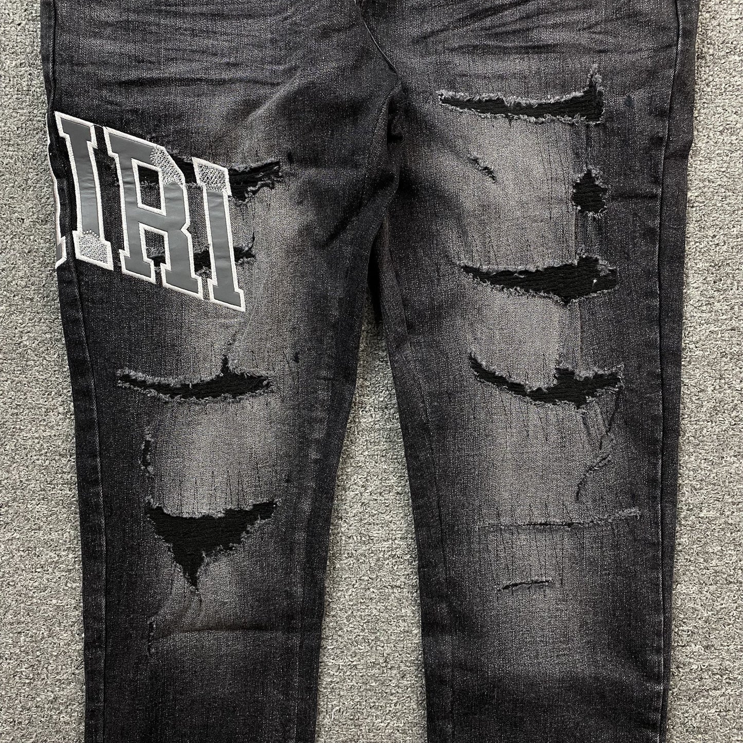 AMIRI VARSITY LOGO REPAIR JEANS - Vanté®