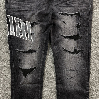AMIRI VARSITY LOGO REPAIR JEANS - Vanté®